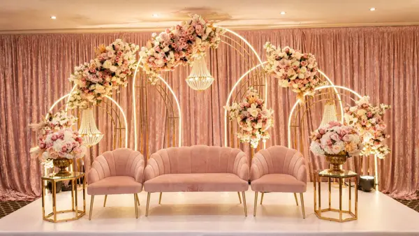 Pink round arches with blush sofas