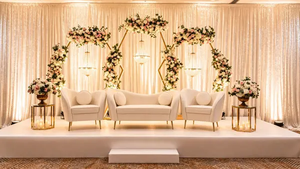 Gold arches with florals and a cream sofa