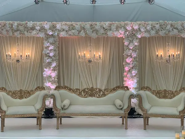 Marquee stage with floral pillars