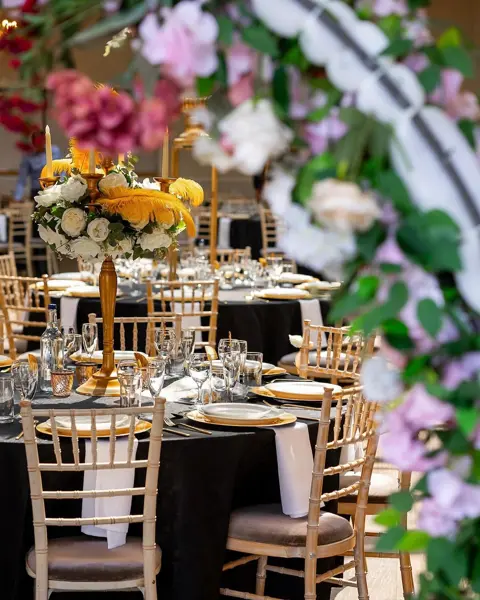 Colourful florals over navy tables