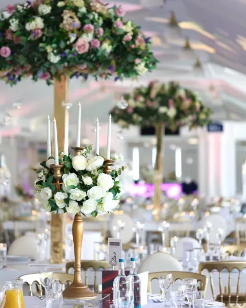 Tall rose topiaries on gold stands