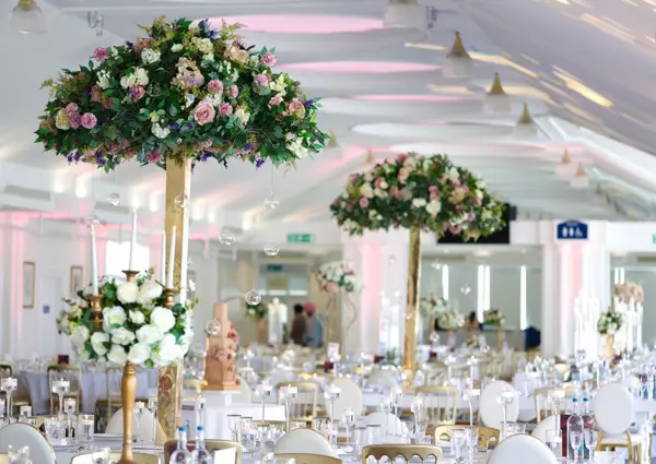 Rose topiaries in a bright function room