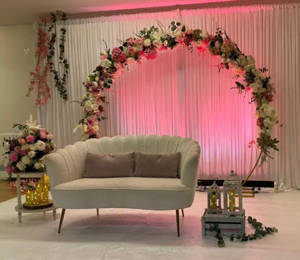 Floral arch with a white sofa
