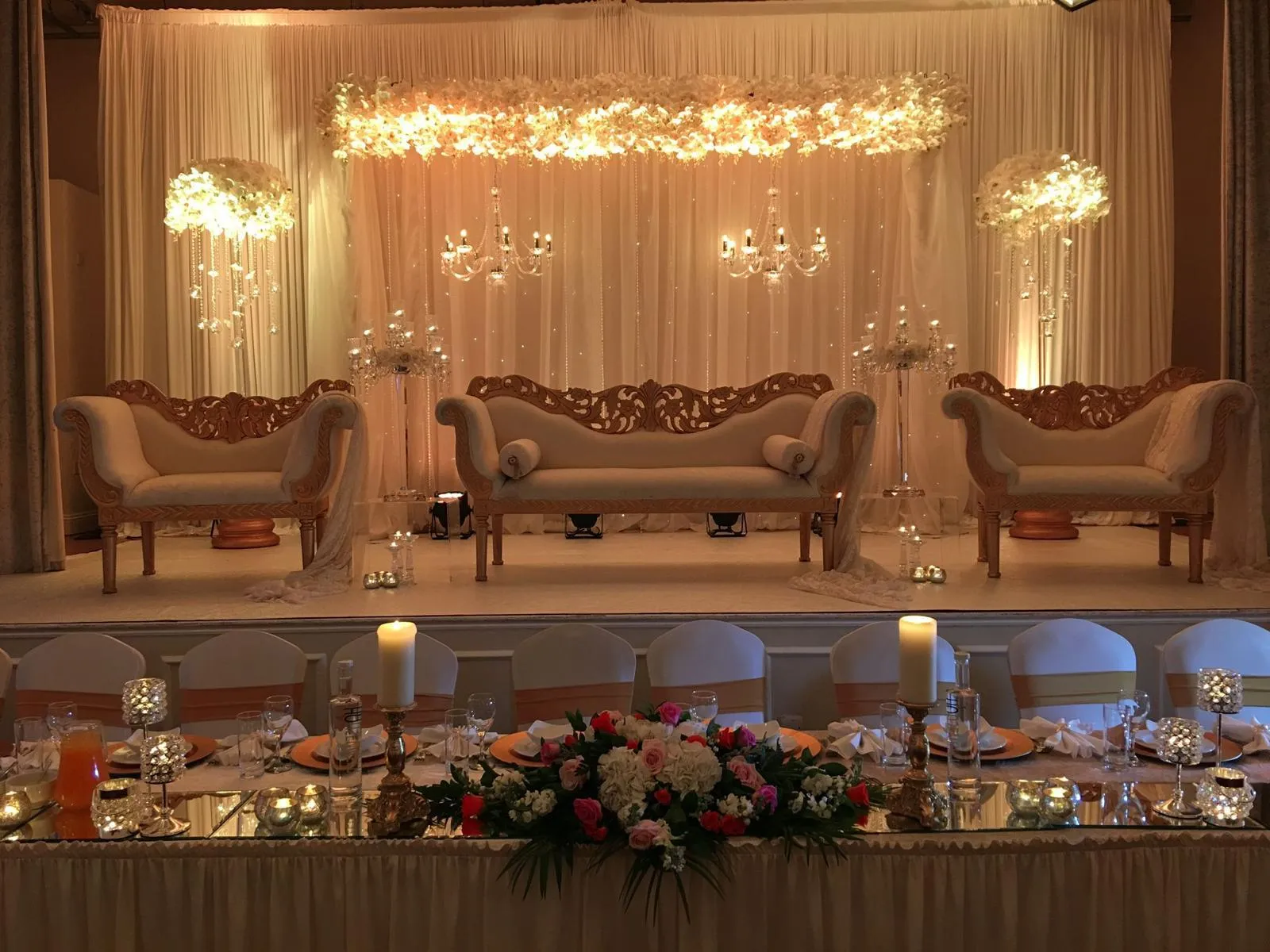 Grand gold stage with ornate sofas
