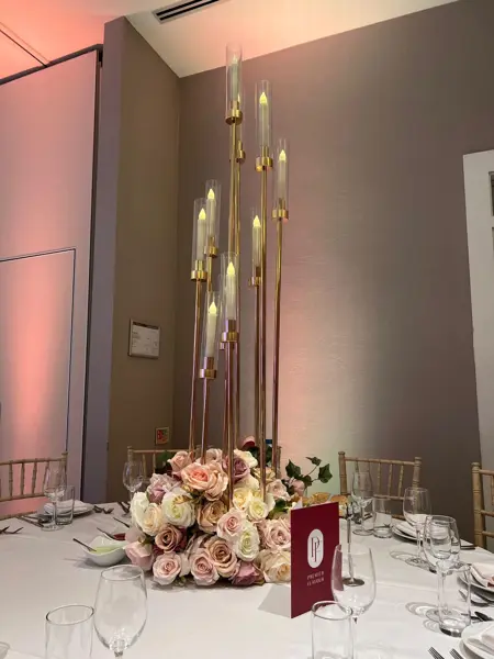 Gold candelabra with pink roses