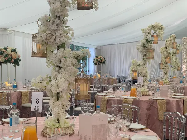 Blossom tree centrepieces in a marquee