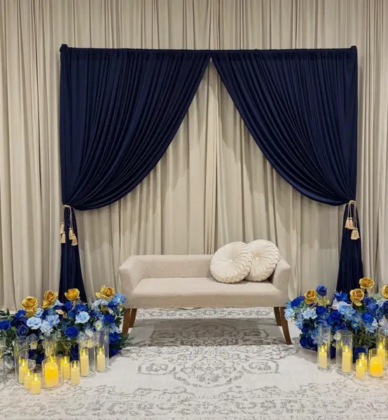 Navy drapes with blue florals and a cream sofa