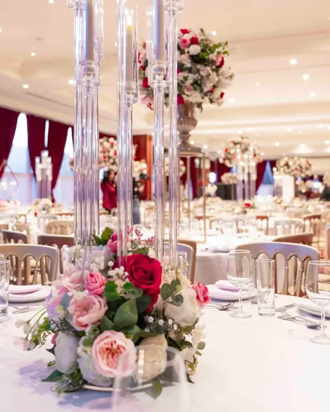 Glass candle poles with pink roses