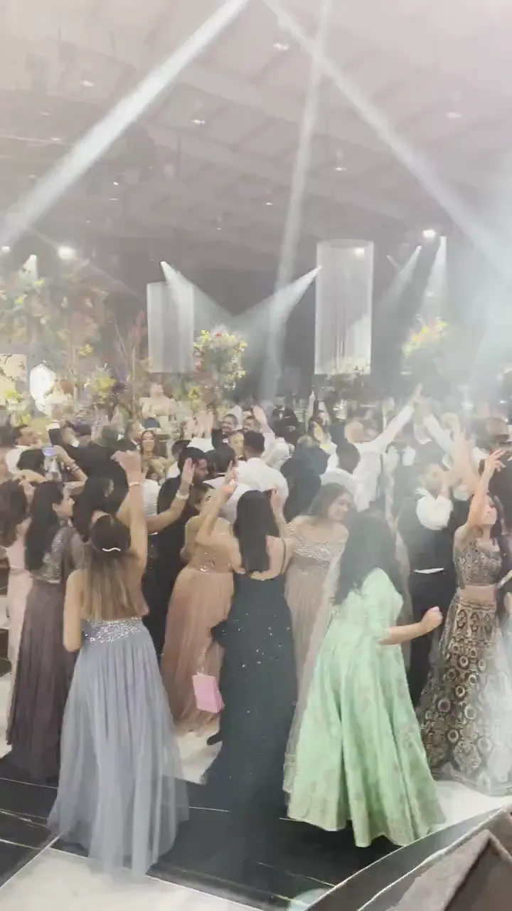Five dhol players and a sax player performing a samba party set