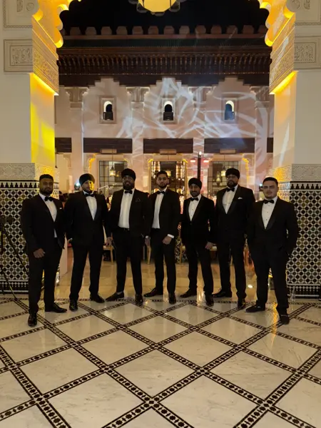 Dhol team in black tie at a luxury venue