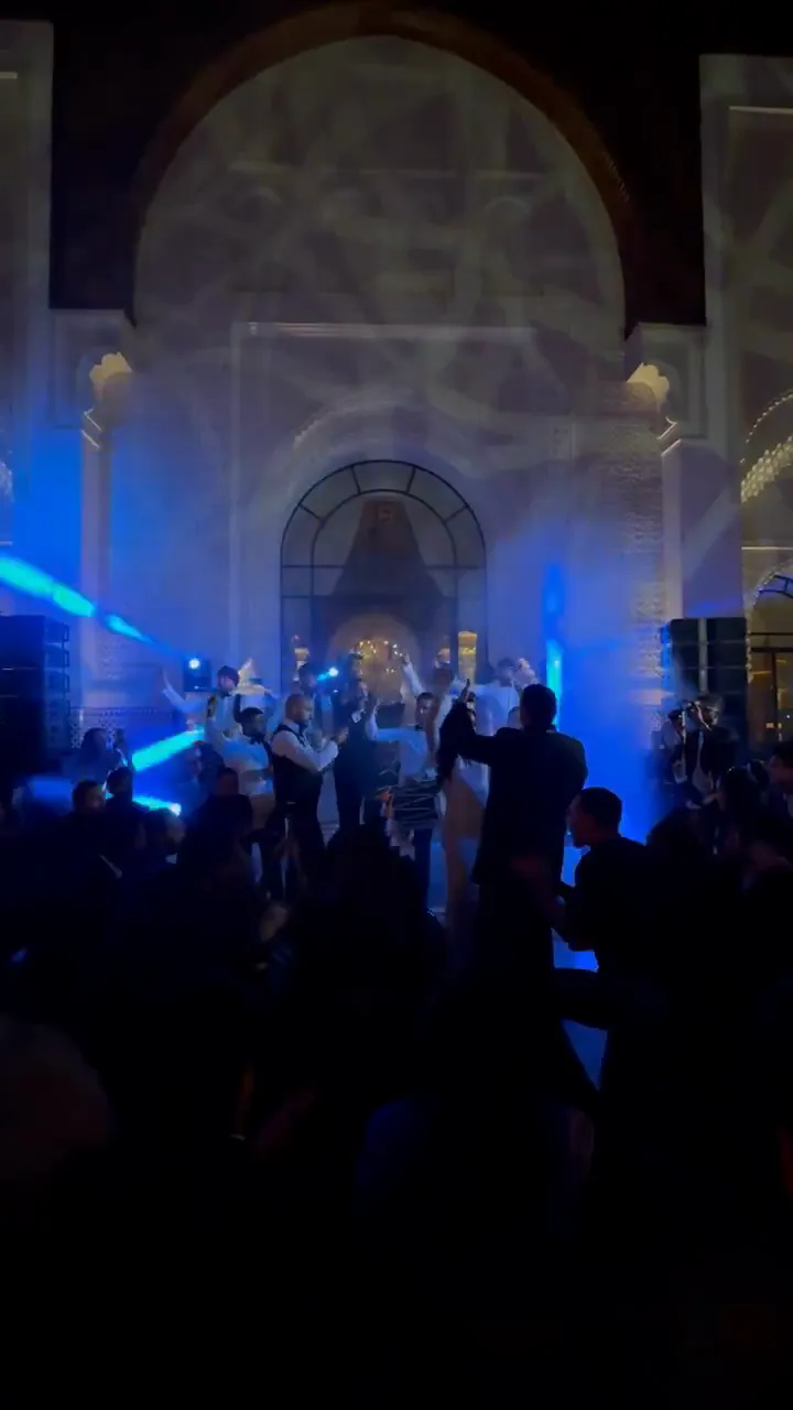 Seven dhol players and a drummer performing a party set at a wedding in Marrakech
