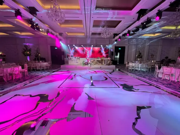 Pink production lighting and a printed dance floor at Fairmont Windsor Park