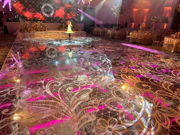 Printed pink and gold dance floor at a wedding reception at Fairmont Windsor Park