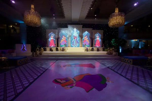Ballroom set with LED screens, a stage and a printed dance floor at Grosvenor House