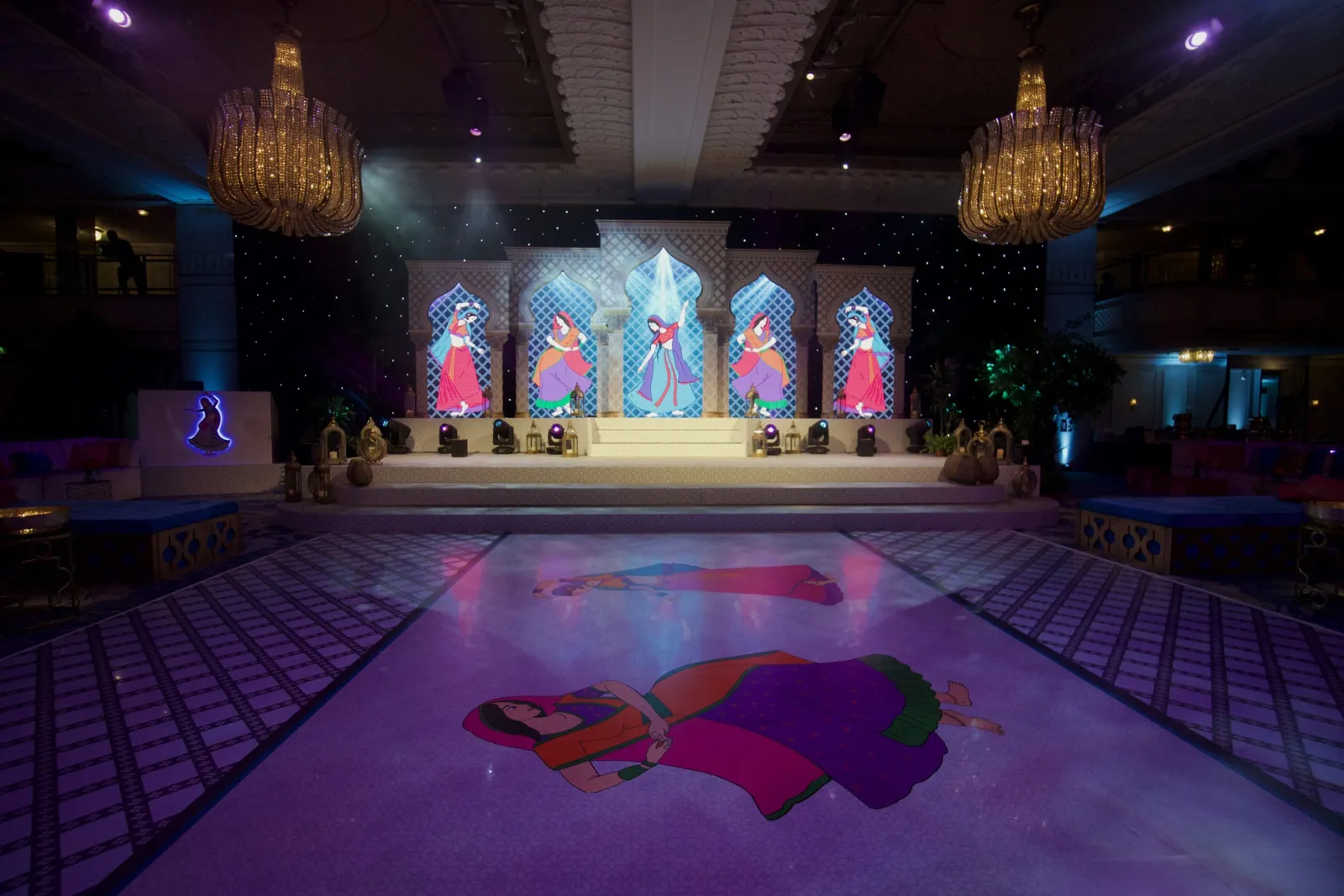 Ballroom set with LED screens, a stage and a printed dance floor at Grosvenor House