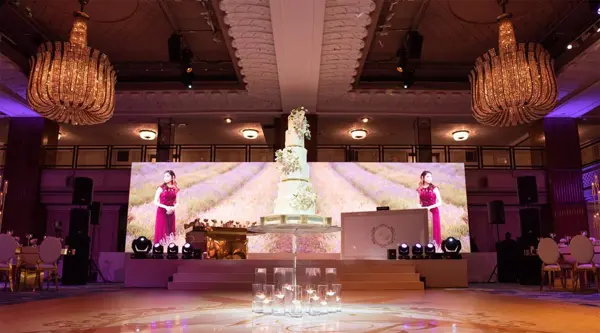 Panoramic LED video wall, staging steps and printed dance floor in a grand ballroom