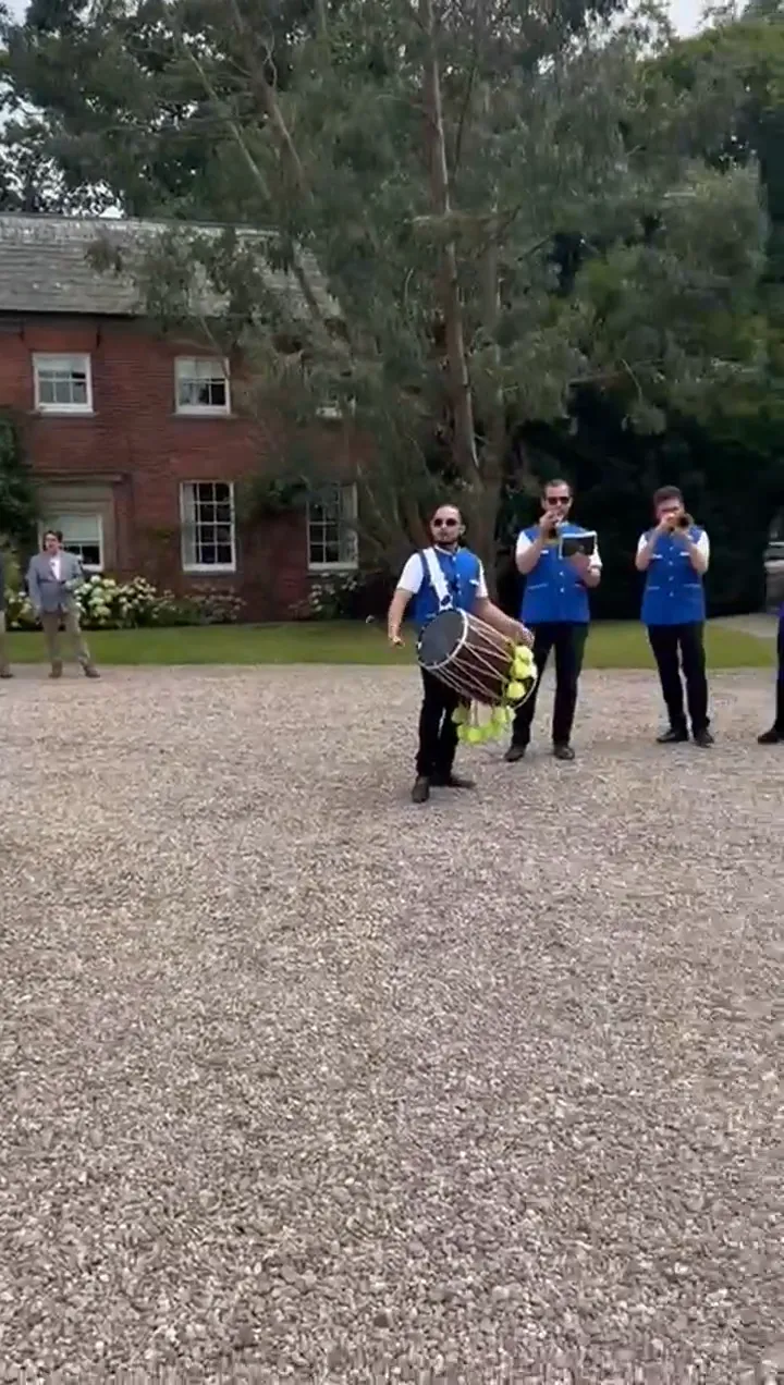 Indian band baja playing at a wedding baraat