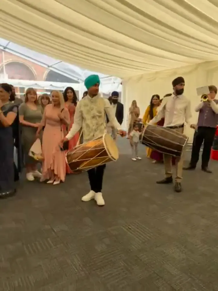 Indian band baja playing at a wedding baraat