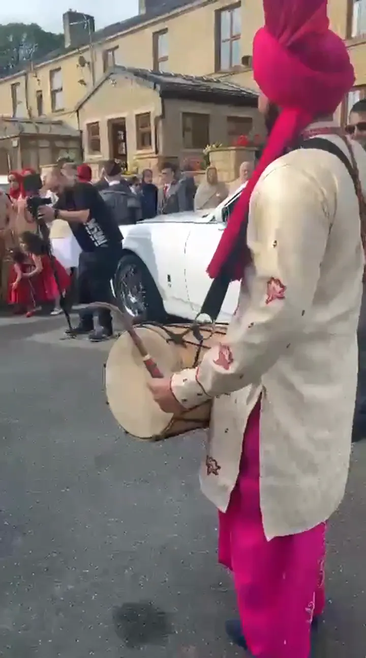 Indian band baja playing at a wedding baraat