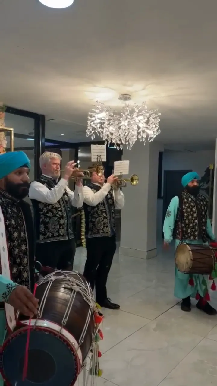 Indian band baja playing at a wedding baraat