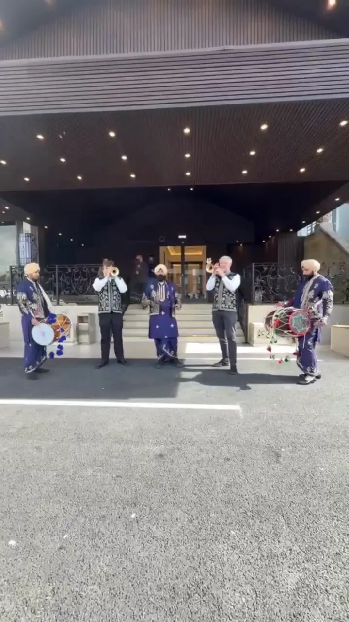 Indian band baja playing at a wedding baraat
