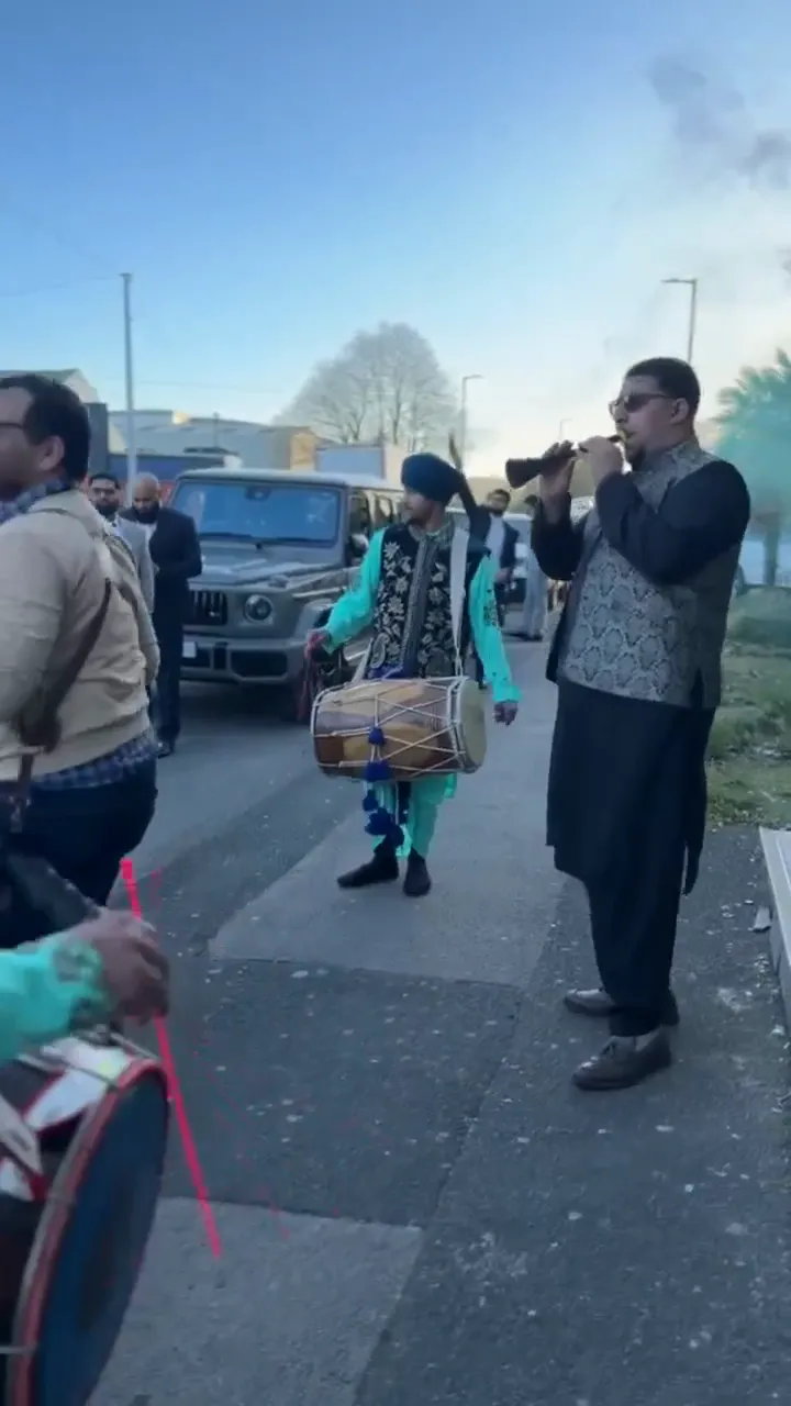 Indian band baja playing at a wedding baraat