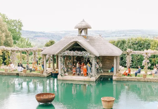 Wedding ceremony in a pavilion beside a lake