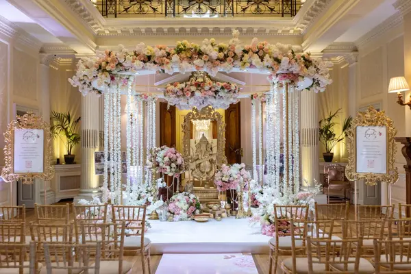 Mandap with crystal strands, floral canopy and a Ganesh murti