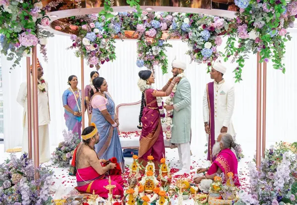 Tamil wedding ceremony under a pastel floral mandap