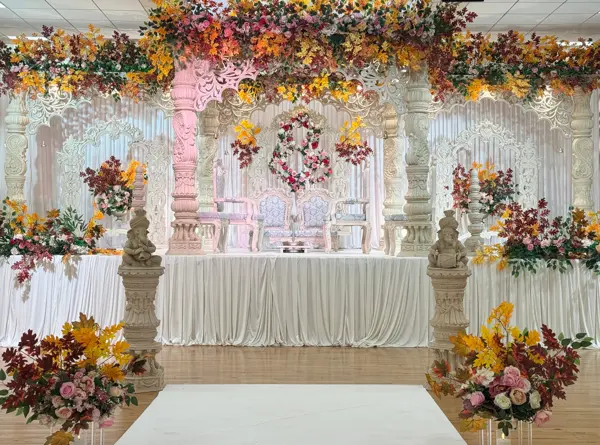 Mandap stage dressed in autumn coloured flowers