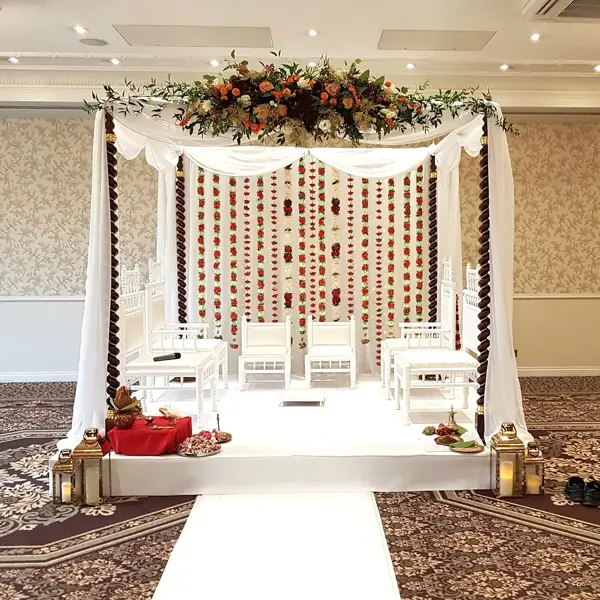 Simple draped mandap with floral canopy