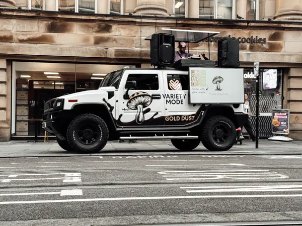 Wrapped DJ truck parked on a city street