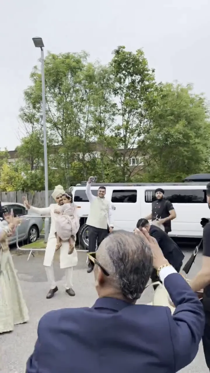 Baraat crowd dancing around the DJ truck