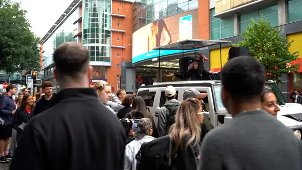 Crowd watching the DJ truck in a city square