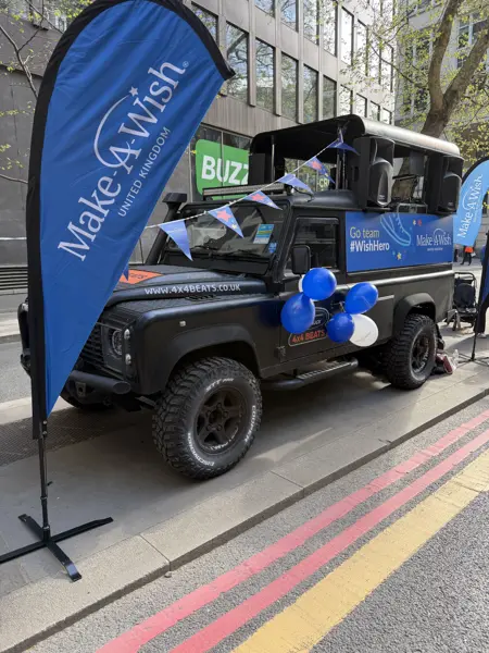 DJ truck wrapped for a charity with flags and balloons