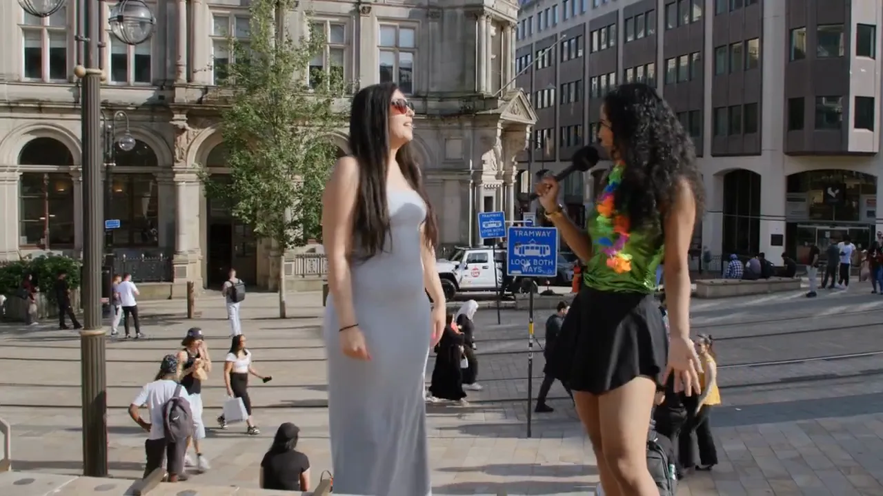 Dancers and hosts at a DJ truck brand activation in a city square