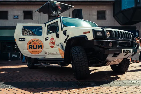 White DJ truck wrapped for a rum brand