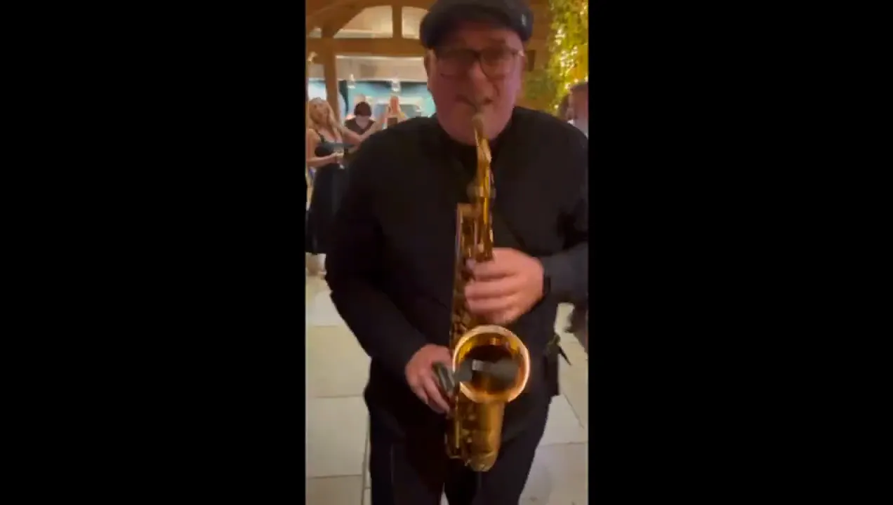 Saxophonist playing at an evening reception