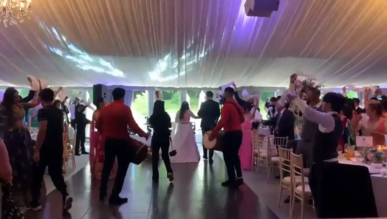 Guests dancing while the violinist plays