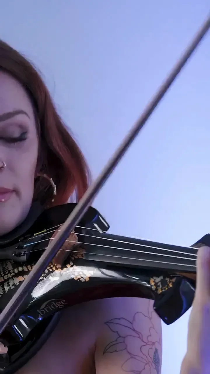 Close up of a violinist playing electric violin