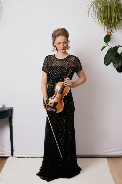 Violinist in a black sequinned dress