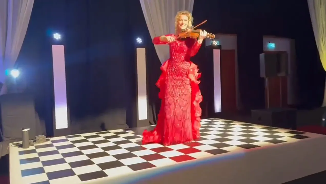 Violinist on an LED dancefloor, the UK