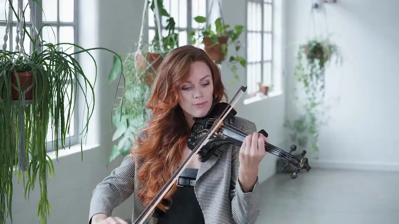 Violinist with red hair playing in a studio