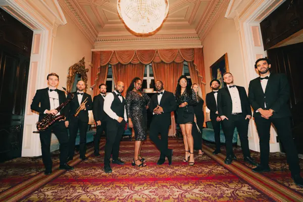 Wedding band in black tie lined up in a grand room