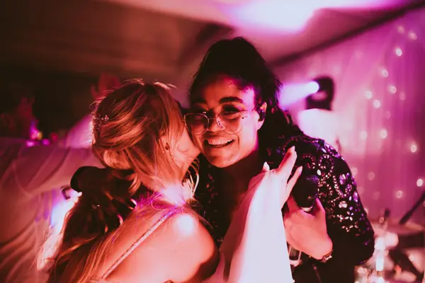 Guests dancing and hugging during the band set